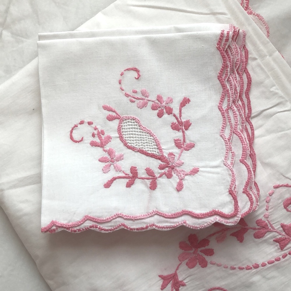 8 Napkins. White and pink embroidered. New. Unused.